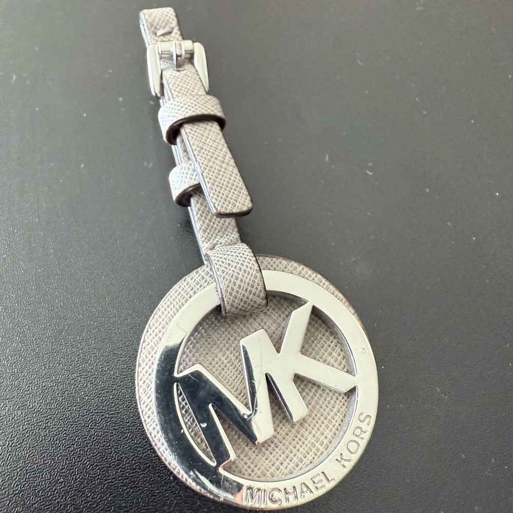 Michael Kors Silver MK Circle Logo Tag with Taupe Textured Strap